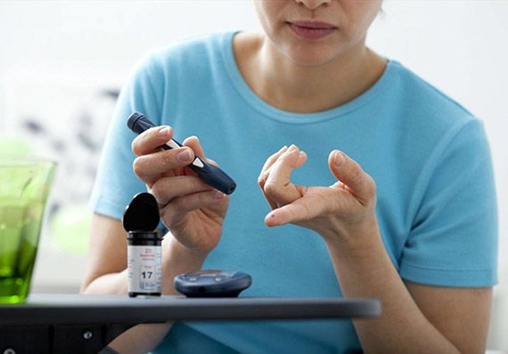Older man walking along a shaded street